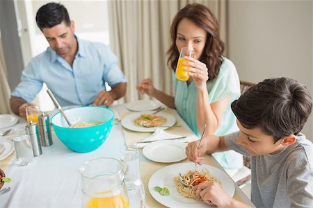 simsearch:400-07275176,k - High angle view of family of three sitting at dining table in the home Stock Photo - Budget Royalty-Free & Subscription, Code: 400-07333628