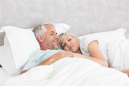 romantic pictures of lovers sleeping - Closeup of a loving mature man and woman lying in bed at the home Stock Photo - Budget Royalty-Free & Subscription, Code: 400-07333759