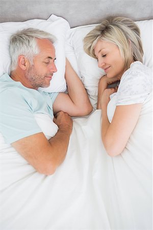 romantic pictures of lovers sleeping - High angle view of a mature couple lying in bed at home Stock Photo - Budget Royalty-Free & Subscription, Code: 400-07333776