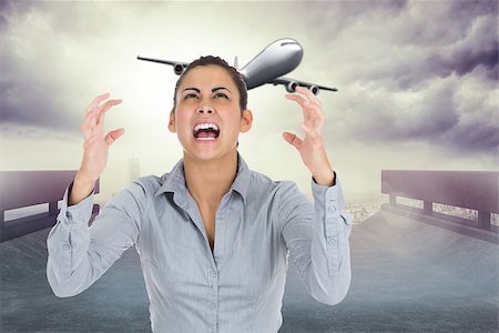 simsearch:400-07347006,k - Furious businesswoman gesturing against cityscape on the horizon Fotografie stock - Microstock e Abbonamento, Codice: 400-07344055