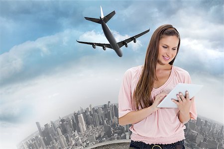 simsearch:400-07347006,k - Close up of a girl using a touchpad against curved cityscape Fotografie stock - Microstock e Abbonamento, Codice: 400-07344116