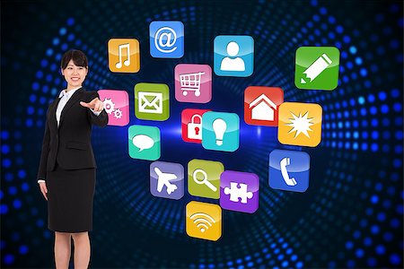 simsearch:400-07345820,k - Smiling businesswoman pointing against futuristic dotted blue and black background Stock Photo - Budget Royalty-Free & Subscription, Code: 400-07344269
