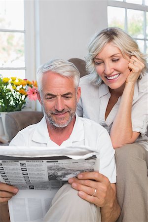 simsearch:400-07333928,k - Happy mature couple reading newspaper at home Stock Photo - Budget Royalty-Free & Subscription, Code: 400-07344362