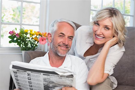 simsearch:400-07333928,k - Portrait of a happy mature couple reading newspaper at home Stock Photo - Budget Royalty-Free & Subscription, Code: 400-07344375