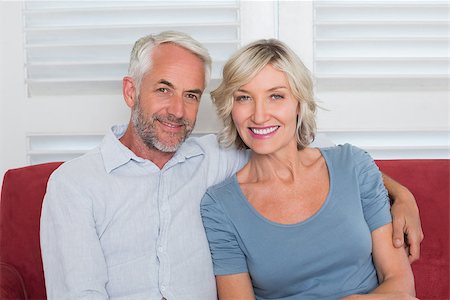 simsearch:400-07333928,k - Portrait of a smiling mature couple sitting on couch at home Stock Photo - Budget Royalty-Free & Subscription, Code: 400-07344399