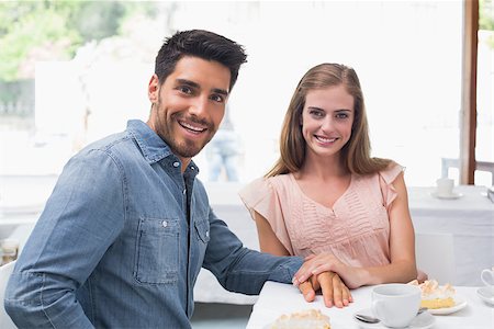 Portrait of a smiling young couple sitting at the coffee shop Stock Photo - Budget Royalty-Free & Subscription, Code: 400-07345563