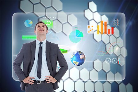 simsearch:400-07343378,k - Smiling businessman with hands on hips against technological background with hexagons Photographie de stock - Aubaine LD & Abonnement, Code: 400-07345692