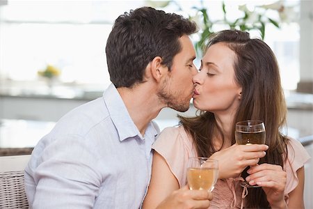 simsearch:400-07346120,k - Close-up of a loving young couple with wine glasses kissing at home Foto de stock - Super Valor sin royalties y Suscripción, Código: 400-07345971