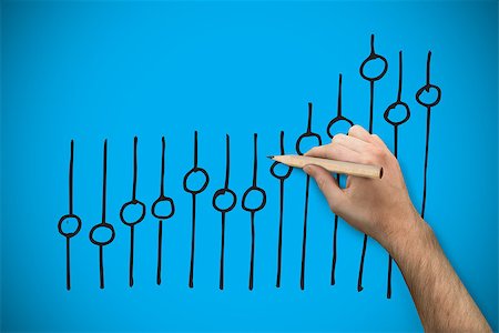 simsearch:400-07339684,k - Hand holding a pencil against blue background with vignette Stock Photo - Budget Royalty-Free & Subscription, Code: 400-07347642
