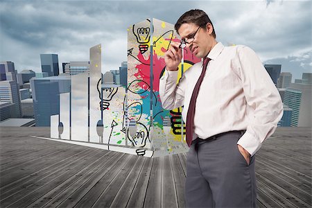 Thinking businessman touching his glasses against cityscape under cloudy sky Stock Photo - Budget Royalty-Free & Subscription, Code: 400-07340319