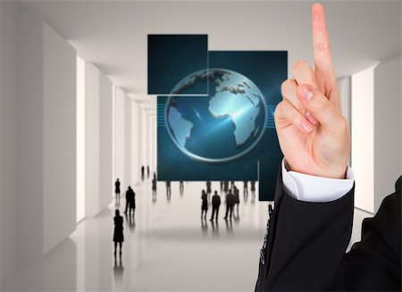 simsearch:614-02838643,k - Businesswoman pointing against tiny figures in huge hall Stock Photo - Budget Royalty-Free & Subscription, Code: 400-07340714