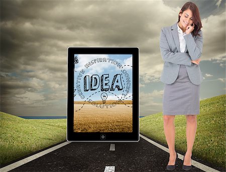 simsearch:400-07258416,k - Happy businesswoman against highway under cloudy sky Stock Photo - Budget Royalty-Free & Subscription, Code: 400-07341146