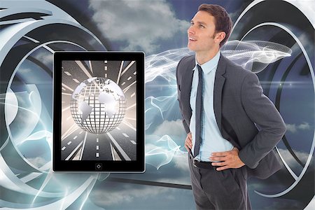 Cheerful businessman standing with hands on hips against cloud and energy design on a futuristic structure Stock Photo - Budget Royalty-Free & Subscription, Code: 400-07341192