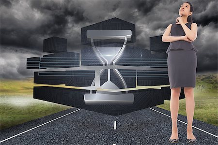 simsearch:400-07183573,k - Thoughtful businesswoman against stormy landscape background with street Stock Photo - Budget Royalty-Free & Subscription, Code: 400-07341416