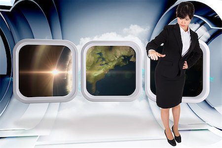 simsearch:400-07341358,k - Businesswoman pointing against abstract blue cloud design in futuristic structure Foto de stock - Super Valor sin royalties y Suscripción, Código: 400-07341938