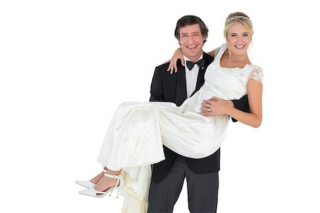 simsearch:400-07473234,k - Portrait of handsome groom carrying bride isolated on white background Stock Photo - Budget Royalty-Free & Subscription, Code: 400-07342382
