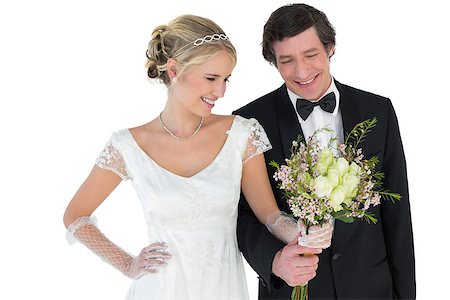 simsearch:400-07473236,k - Loving newlywed couple holding bouquet isolated on white background Stockbilder - Microstock & Abonnement, Bildnummer: 400-07342394