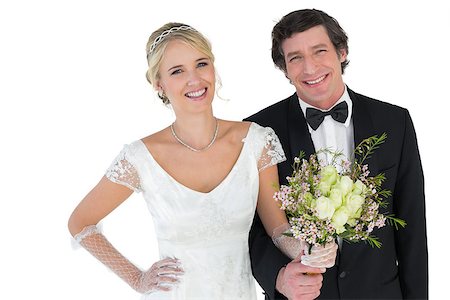 simsearch:400-07473236,k - Portrait of beautiful newlywed couple holding bouquet on white background Stockbilder - Microstock & Abonnement, Bildnummer: 400-07342391