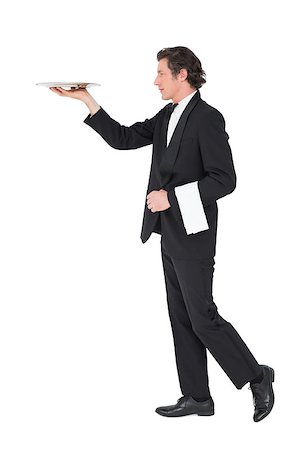 person and cut out and waiter - Full length of waiter in suit carrying tray isolated over white background Stock Photo - Budget Royalty-Free & Subscription, Code: 400-07342473