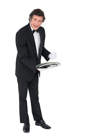 person and cut out and waiter - Portrait of confident waiter showing empty tray over white background Stock Photo - Budget Royalty-Free & Subscription, Code: 400-07342484