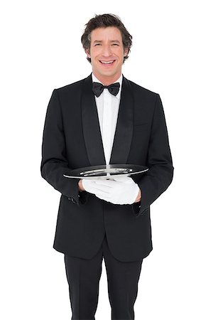 person and cut out and waiter - Portrait of happy waiter holding empty tray over white background Stock Photo - Budget Royalty-Free & Subscription, Code: 400-07342489