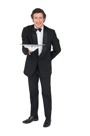 person and cut out and waiter - Full length portrait of waiter holding tray over white background Stock Photo - Budget Royalty-Free & Subscription, Code: 400-07342482