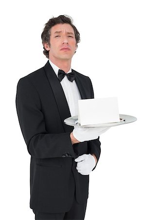 person and cut out and waiter - Portrait of confident waiter holding tray against white background Stock Photo - Budget Royalty-Free & Subscription, Code: 400-07342491