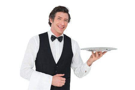 person and cut out and waiter - Portrait of happy waiter holding tray against white background Stock Photo - Budget Royalty-Free & Subscription, Code: 400-07342508