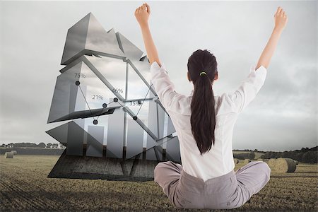 simsearch:400-04529073,k - Businesswoman sitting cross legged cheering against landscape with bales of straw Foto de stock - Super Valor sin royalties y Suscripción, Código: 400-07342525