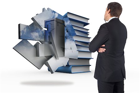 simsearch:400-07447273,k - Thinking businessman against stack of books Stock Photo - Budget Royalty-Free & Subscription, Code: 400-07342637