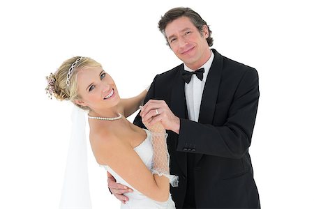 Portrait of happy couple dancing over white background Stock Photo - Budget Royalty-Free & Subscription, Code: 400-07342897