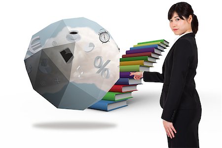 simsearch:614-02838643,k - Focused businesswoman pointing against steps made from books Stock Photo - Budget Royalty-Free & Subscription, Code: 400-07343032