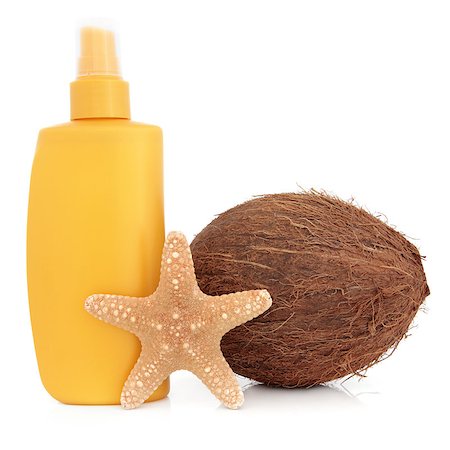 simsearch:400-04806901,k - Suntan lotion bottle with coconut and starfish shell over white background. Foto de stock - Royalty-Free Super Valor e Assinatura, Número: 400-07406143