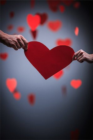 Two hands holding heart Stock Photo - Budget Royalty-Free & Subscription, Code: 400-07406368