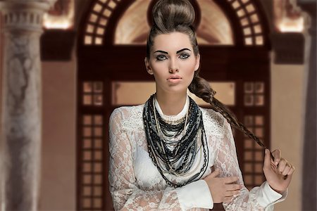 simsearch:400-07425613,k - portrait of sensual young brunette woman with creative fashion style and cute hairdo and make-up. Wearing white lace shirt and a lot of necklaces Stock Photo - Budget Royalty-Free & Subscription, Code: 400-07406427