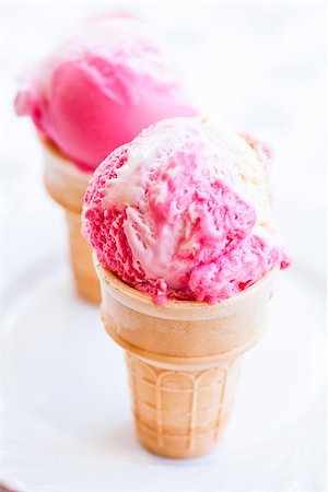 simsearch:400-07408343,k - Closeup of two cones of raspberry and vanilla ice cream on light background Stock Photo - Budget Royalty-Free & Subscription, Code: 400-07408344