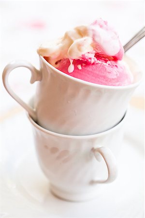 simsearch:400-07408343,k - Closeup of cup with raspberry and vanilla ice cream and spoon on light background Stock Photo - Budget Royalty-Free & Subscription, Code: 400-07408342