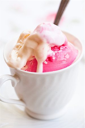 simsearch:400-07408343,k - Closeup of cup with raspberry and vanilla ice cream and spoon on light background Stock Photo - Budget Royalty-Free & Subscription, Code: 400-07408343