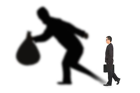 businessman walking and holding bag  with thief shadow Stock Photo - Budget Royalty-Free & Subscription, Code: 400-07409003