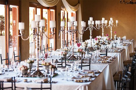 Hall at a wedding reception with decorated tables Foto de stock - Super Valor sin royalties y Suscripción, Código: 400-07409586