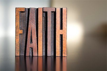 simsearch:400-07325569,k - The word FAITH written in vintage wooden letterpress type Fotografie stock - Microstock e Abbonamento, Codice: 400-07409626