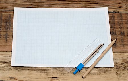 Geometry set with compass,pencil,ruler on graph paper Stock Photo - Budget Royalty-Free & Subscription, Code: 400-07409718
