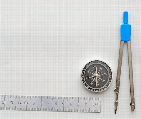 simsearch:400-04269440,k - Still life photo of engineering graph paper with pencil, compass and metal ruler blank to add your own design Photographie de stock - Aubaine LD & Abonnement, Code: 400-07409723