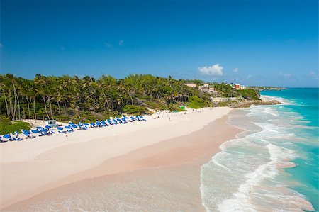 simsearch:400-07625542,k - Crane Beach is one of the most beautiful beaches on the Caribbean island of Barbados. It is a tropical paradise with palms hanging over turquoise sea Foto de stock - Super Valor sin royalties y Suscripción, Código: 400-07414340