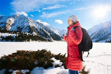 simsearch:400-08283887,k - Young woman take a walk on winter mountain slope (Big Almaty Lake, Kazakhstan) Photographie de stock - Aubaine LD & Abonnement, Code: 400-07415225