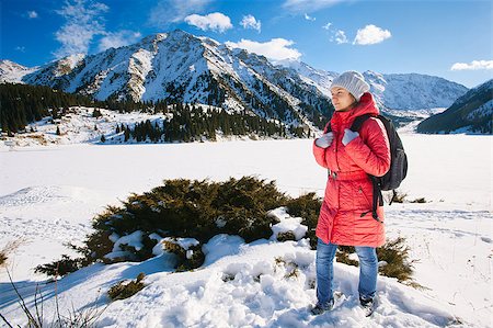 simsearch:400-08283887,k - Young woman take a walk on winter mountain slope (Big Almaty Lake, Kazakhstan) Photographie de stock - Aubaine LD & Abonnement, Code: 400-07415223