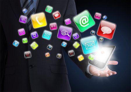 simsearch:400-07446368,k - Man in suit holding a smartphone in hand. Application icons around smartphone. The concept of software Foto de stock - Super Valor sin royalties y Suscripción, Código: 400-07415308