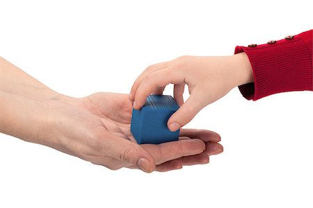 Child grabs blue wooden cube toy from mom's hands isolated on white background Stock Photo - Budget Royalty-Free & Subscription, Code: 400-07416504