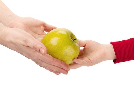 Mothers hands give apple to child's hands isolated on white background Stock Photo - Budget Royalty-Free & Subscription, Code: 400-07416505