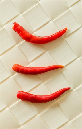 simsearch:400-06864396,k - three small chilly peppers on creamy tablecloth Stock Photo - Budget Royalty-Free & Subscription, Code: 400-07416694